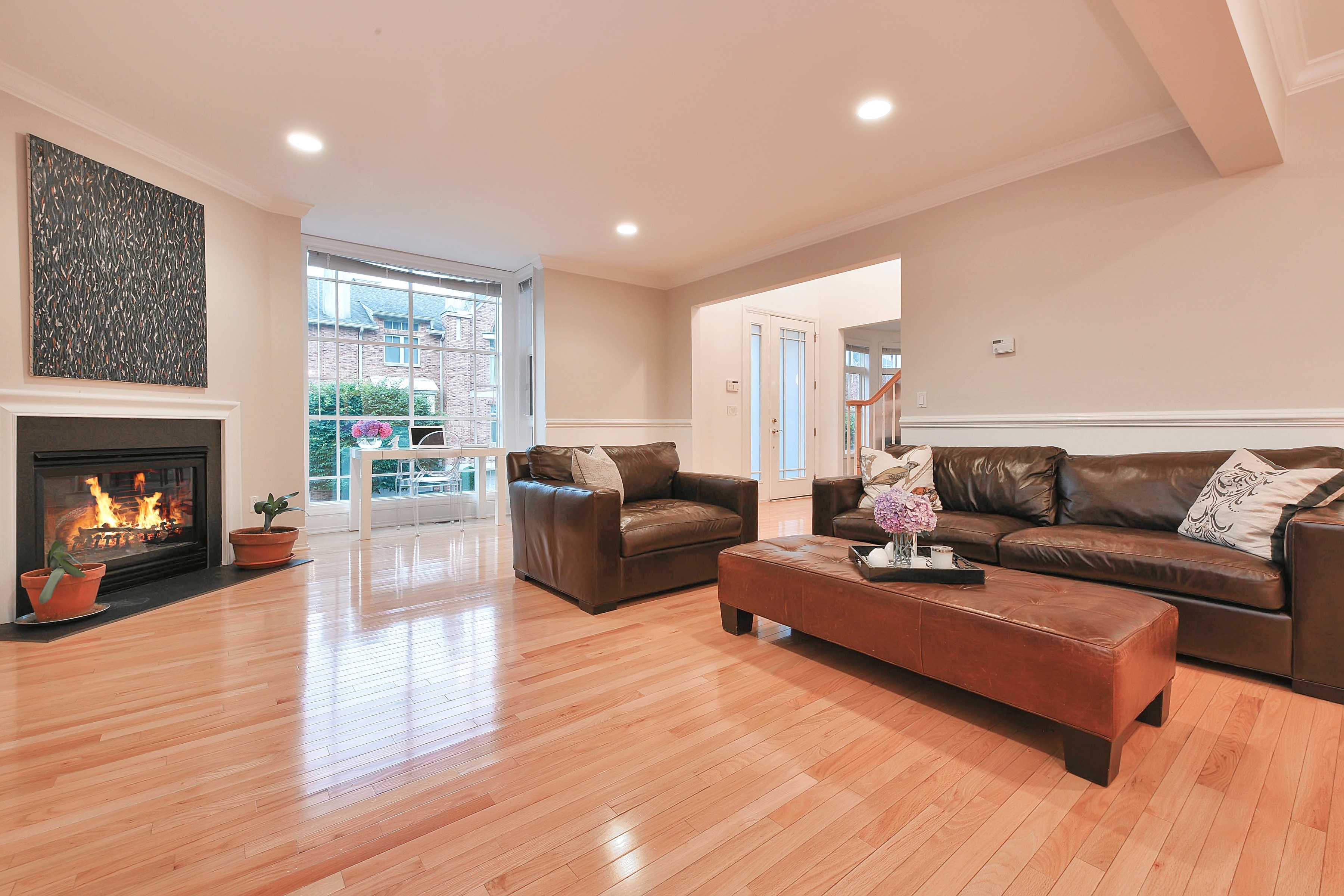 141 hudson cove edgewater nj 07020 wide living room with fireplace and brown furniture