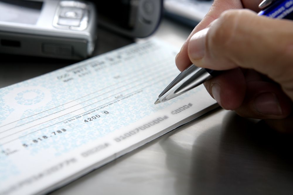 person signing a cheque